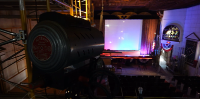 Spotlight pointed to stage at Millstone Theatre in Millsboro.