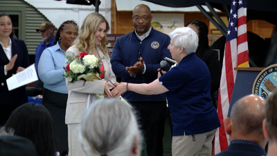 Jenna Carlton receiving the inaugural Woman Veteran of the Year at the Air Mobility Command Museum.