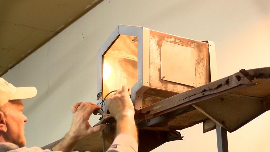 Pond Working on Sign