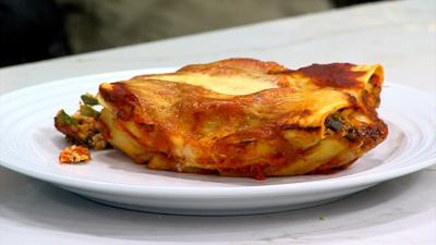 Vegetarian Manicotti Dish, plated on a white plate on a with counter.