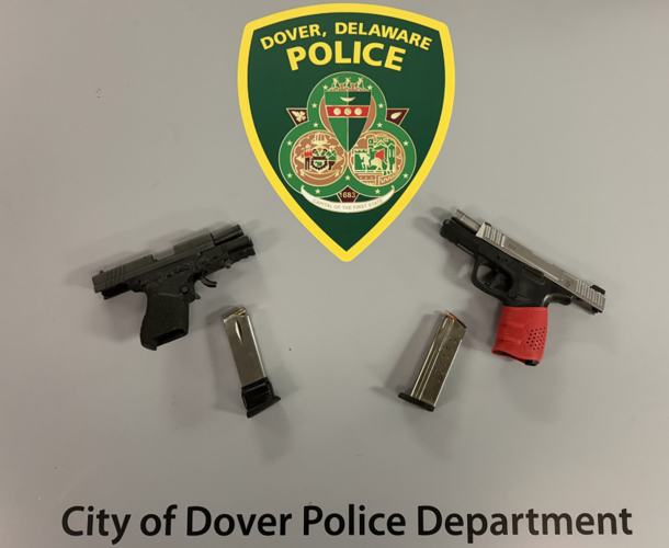 Two handguns and their ammunition clips.