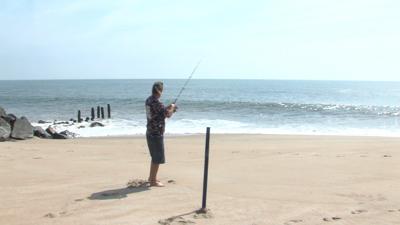 Surf Fisherman Ponders Eclipse's Effect on Fish