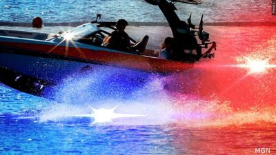 A boat with police lights around it.