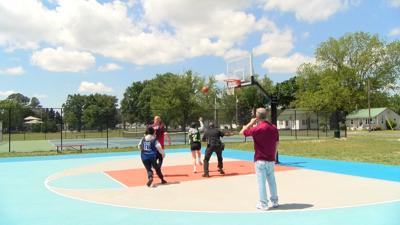 Teens play with Greensboro Police Chief and Organizer