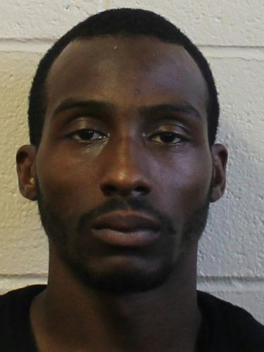 Tyrone Hughey stares directly at the camera