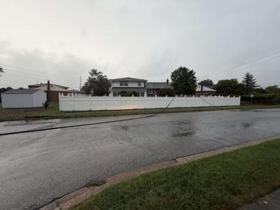 Downed power lines block a stretch of road in the Sherwood area of Dover. 
