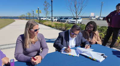 Tauhid Islam, CEO and President of Pinnacle Hospitality Group signing an agreement with the non-profit Cambridge Waterfront Development Inc. to advance a hotel on the Cambridge Harbor. (WBOC).
