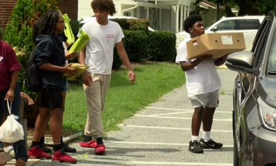 Kids handing out free food