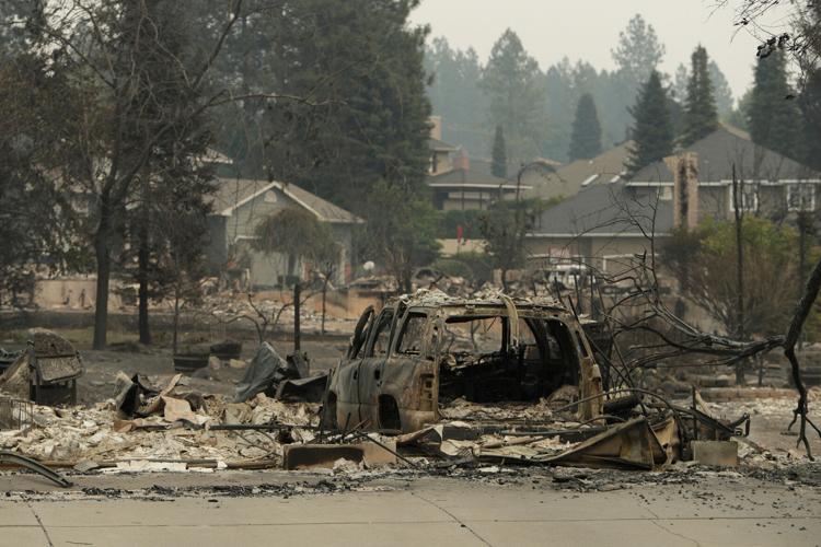 Photos show destruction from wildfires in Greece as blazes take hold in Europe and parts of the US