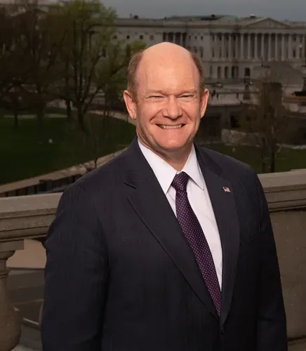 Delaware Senator Chris Coons smiling for the camera.