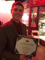 Ryan-McNulty-Facebook-pic-holding-award