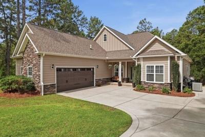 Love Pines Realty Lists One-Acre Southern Pines Retreat Backing to Private Forest