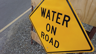 Water on Road Sign