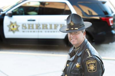 Sheriff Mike Lewis stands in front of a Wicomico County Sheriff's Office patrol car