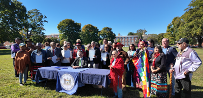 Gov. Matt Meyer, joined by other lawmakers and Indigenous leaders, as HB 365 is signed.