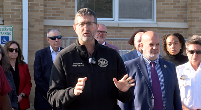 Governor Matt Meyer speaks with the press after touring the damage at Lulu M. Ross Elementary School in Milford, Delaware.