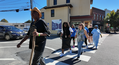 People walking in downtown Cambridge to celebrate "Walk Maryland Day." 