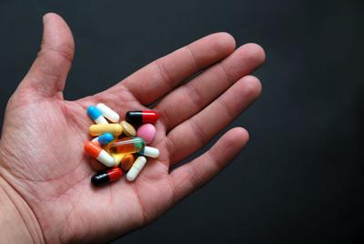pills in hand medicine prescription drugs