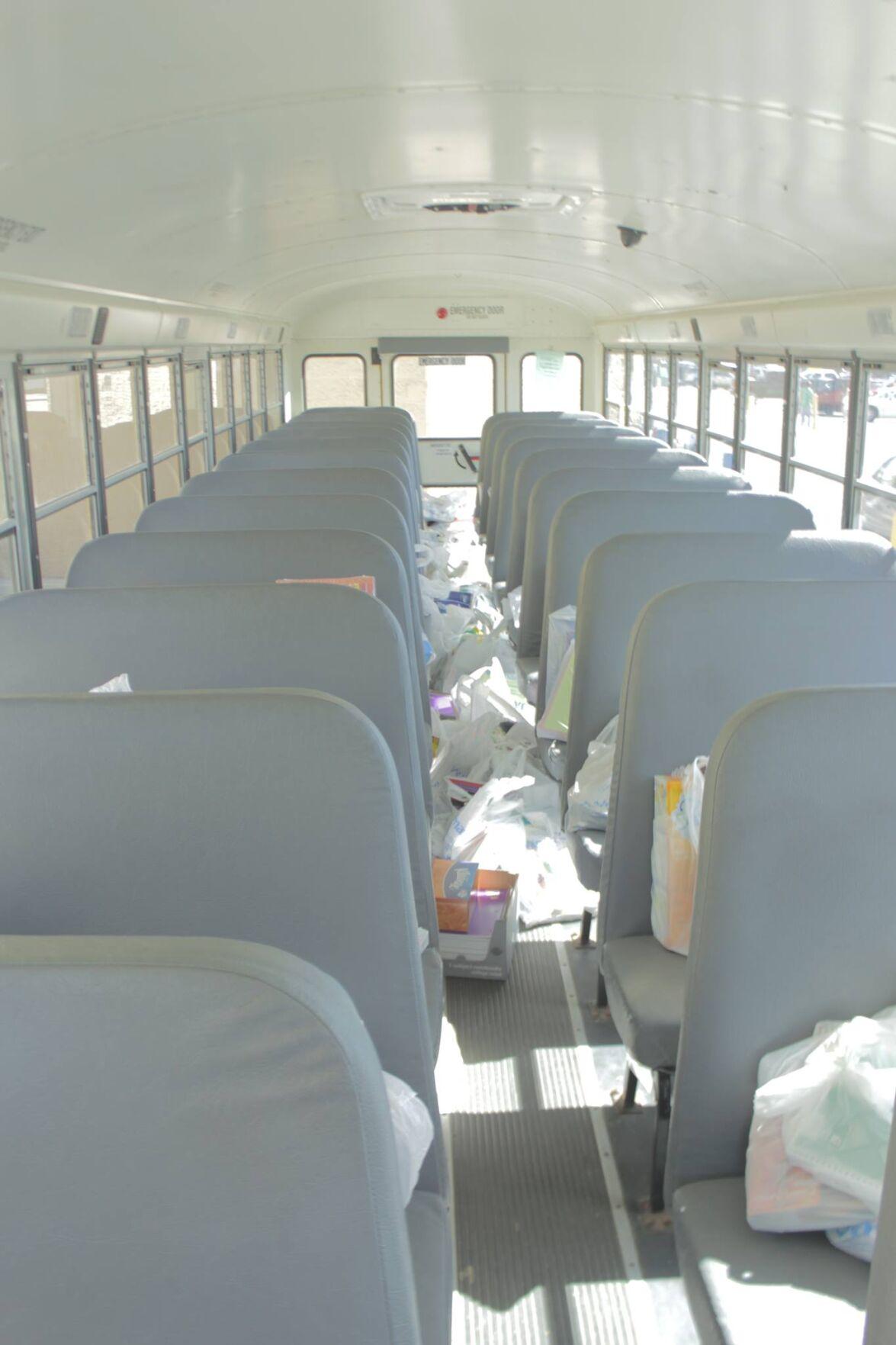 We Care of Grundy County Stuffs The Bus To Help Children Return Back To