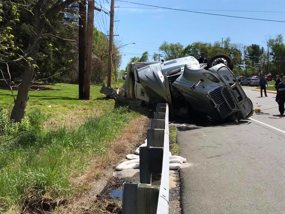 Tractor trailer hauling pineapples, bananas rolls over in Hockessin