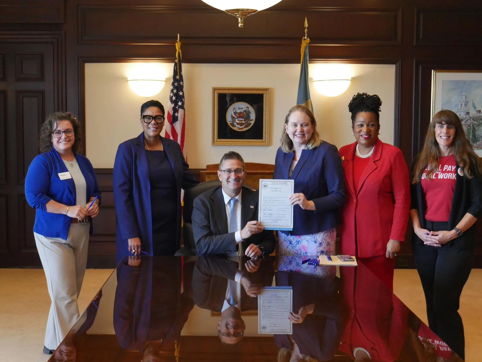 Gov. Meyer signs bills on pay transparency, massage business licensing