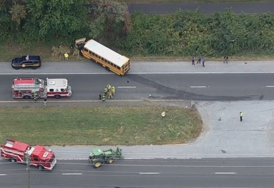 One dead in crash involving a farm tractor and school bus