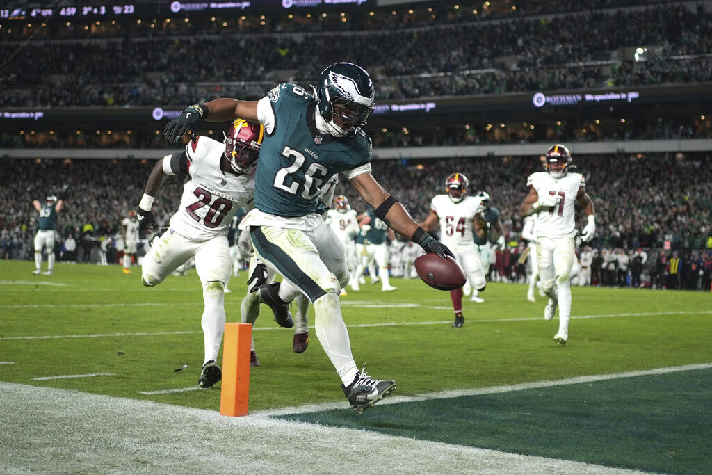 Saquon Barkley runs for 2 TDs, Eagles beat Commanders 26-18 to stretch NFC East lead