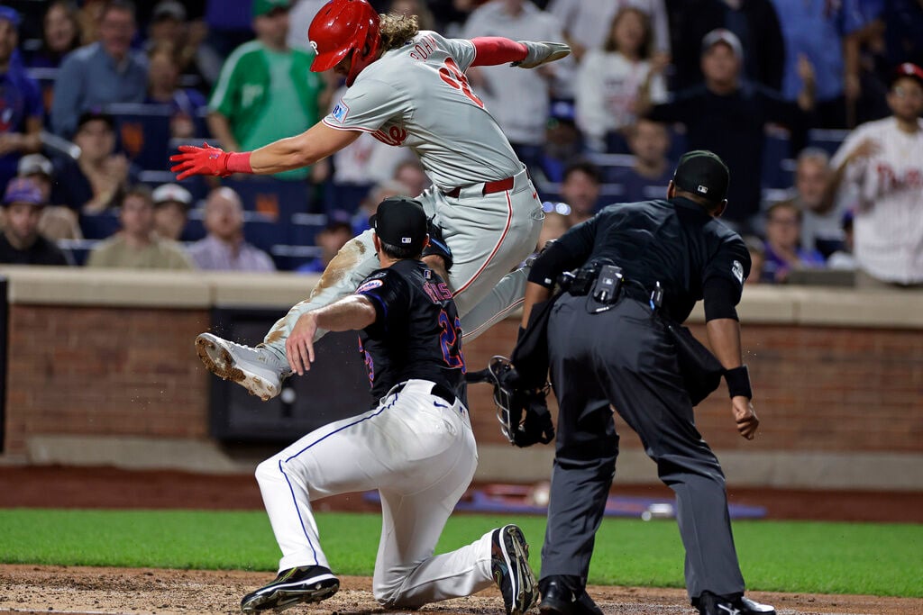 Phillies rout Mets to punch playoff ticket and near NL East crown