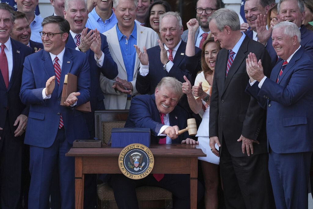 Trump signs his tax and spending cut bill at the White House July 4 picnic