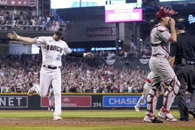 Marte hits walk-off single in ninth, D-backs beat Phillies 2-1 in NLCS Game  3, The Latest from WDEL Sports