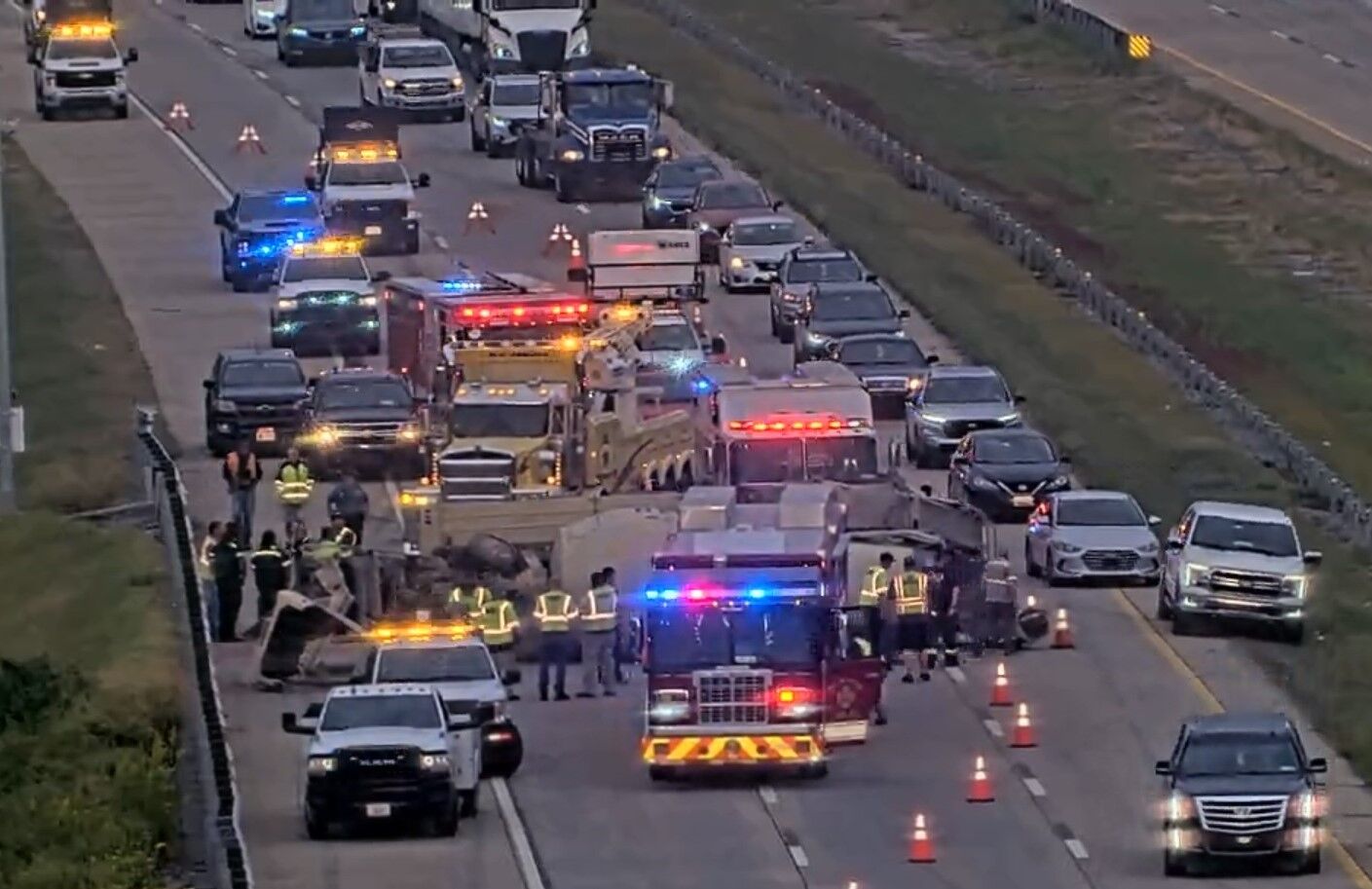 Rollover cement mixer jams traffic solid