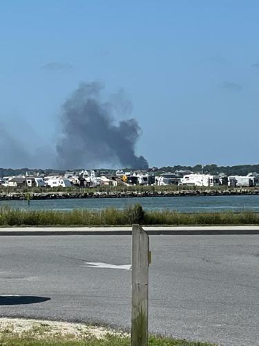 Fire from a Bethany Lakes home could be seen from the Delaware Seashore State Park Campground on July 12, 2022