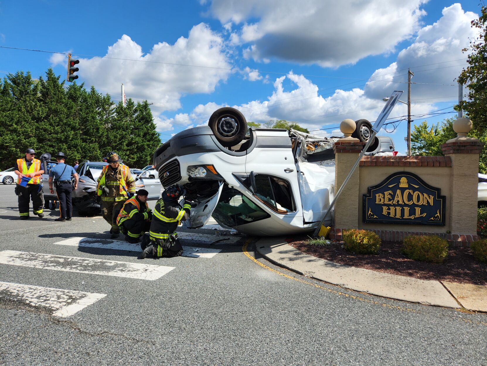 Medics treat one from noontime rollover crash