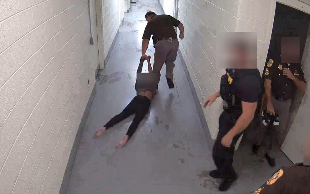 WATCH: New Castle County Police officer drags young woman down hallway at police headquarters