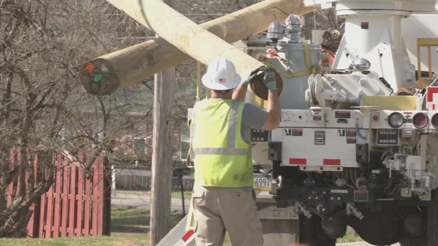 LG&E lineman handles utility pole in Jeffersontown