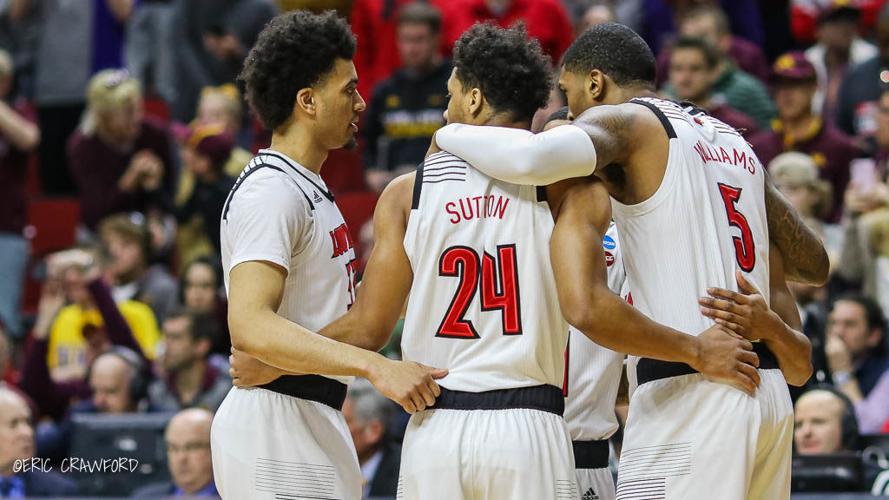 Louisville basketball huddle