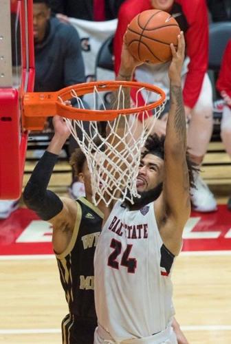 Trey Moses dunks during a game