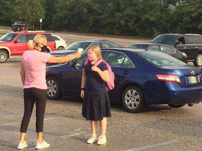 Student getting temperature checked at Christian Academy of Indiana