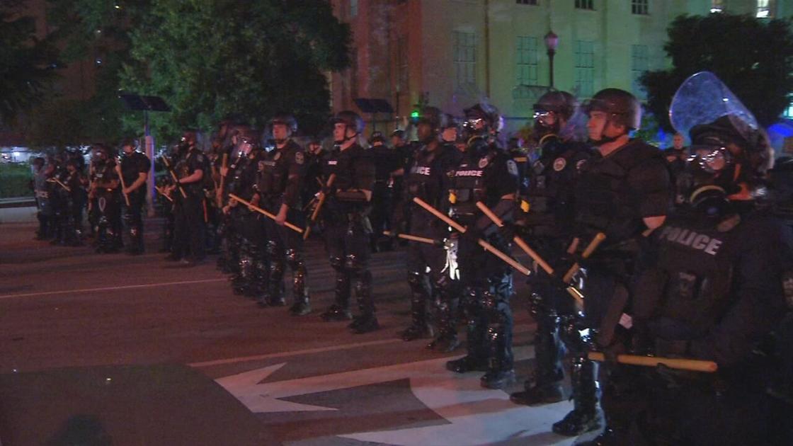 LMPD officers in riot gear in downtown Louisville | | wdrb.com