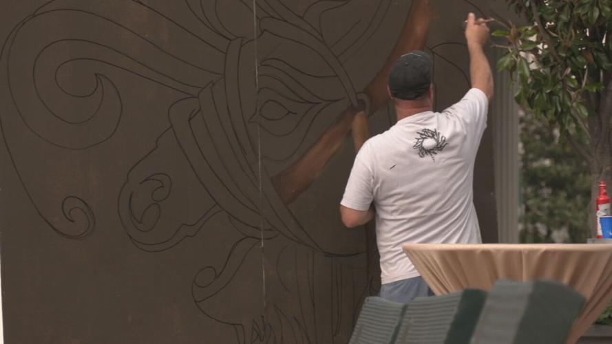 DOWNS AFTER DARK artist paints mural.jpeg