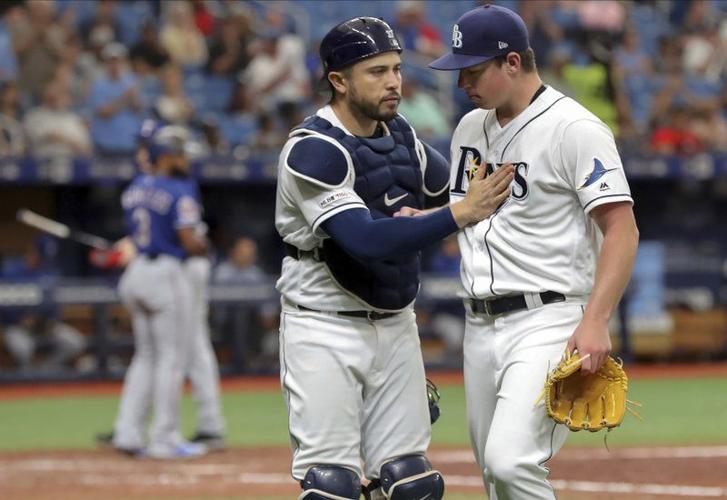Tampa Bay Rays catcher Travis d'Arnaud congratulates starting pitcher Brendan McKay