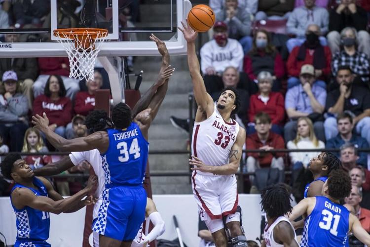 Alabama forward James Rojas blocks a shot from Kentucky forward Oscar Tshiebwe.jpeg