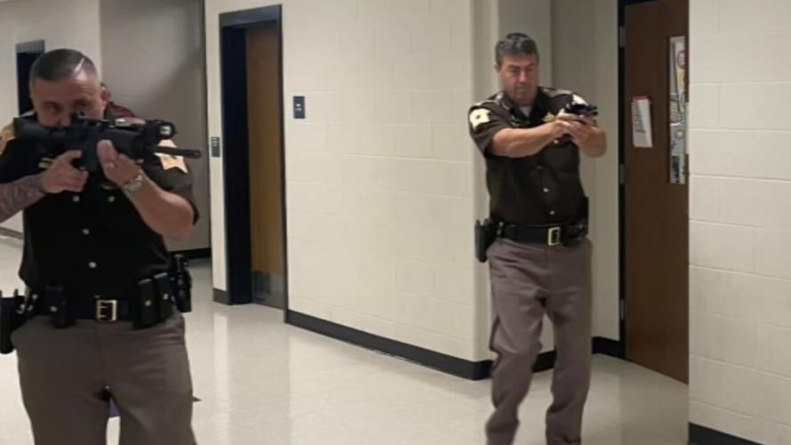 Deputies point guns during active shooter training at Riverside Elementary