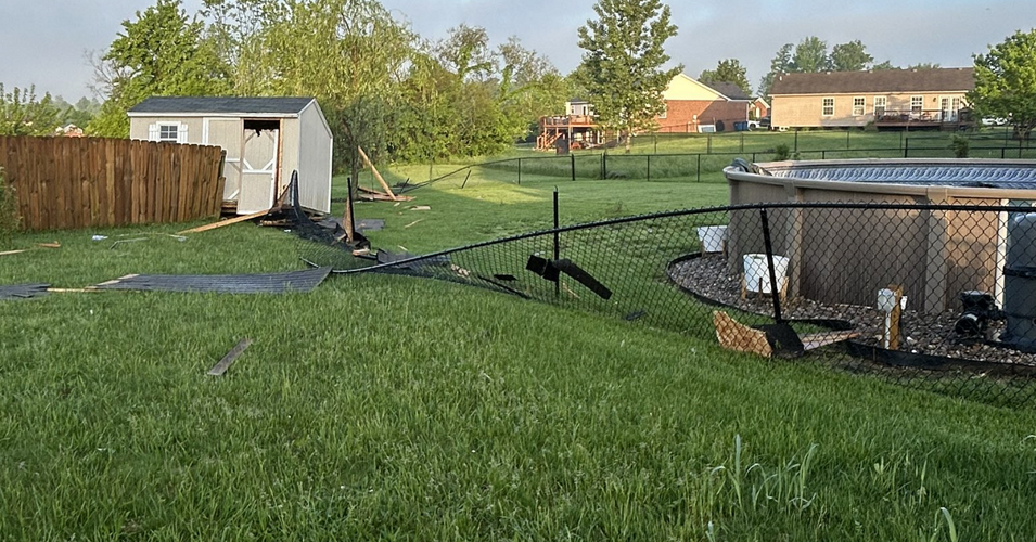 Damaged fence near pool in Sellersburg, Indiana after storms on May 7, 2024