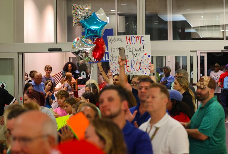 Sign held up at exit during Honor Flight Return Home.JPG