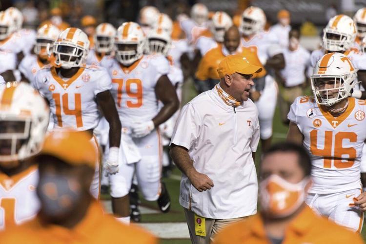 Tennessee coach Jeremy Pruitt talks with Will Albright