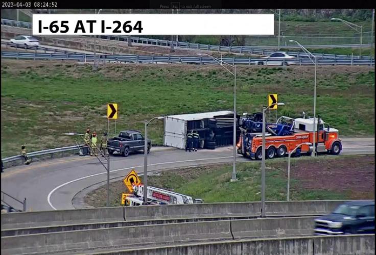 Wrecker near overturned semi on I-264W ramp to I-65S in Louisville