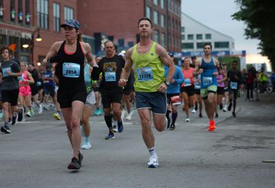 Runners move down Main Street during Marathon.JPG