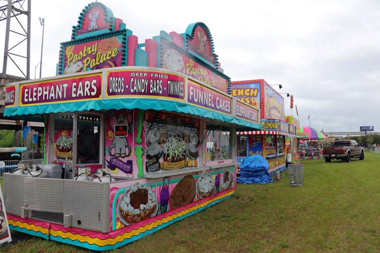 Crews set up booths along the Ohio River one day before Thunder Over Louisville 2023