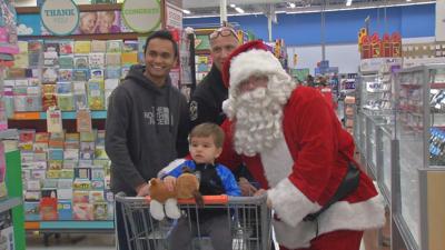 LMPD and 'Santa Claus' hand out gift cards at Walmart